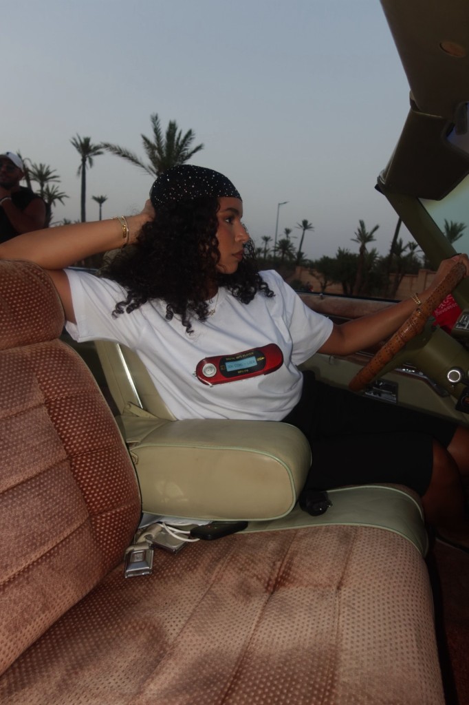 White tee behind the wheel